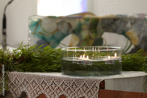 vessel with candles floating in church