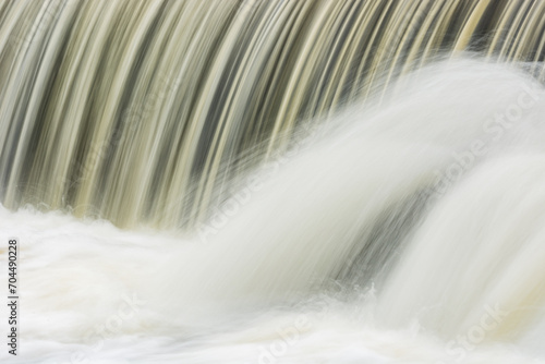 Landscape captured with motion blur of a cascade on the Rabbit River, Michigan, USA