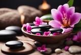 Spa background with massage stones exotic flowers and copy space