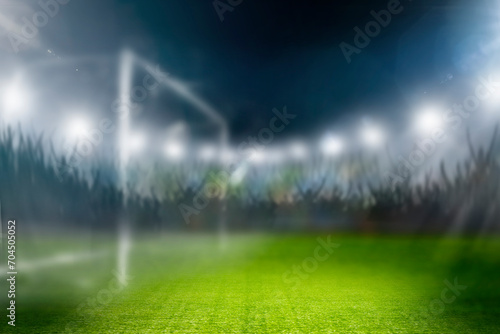 Fussball im Scheinwerferlicht in einem Fussballstadion © by-studio