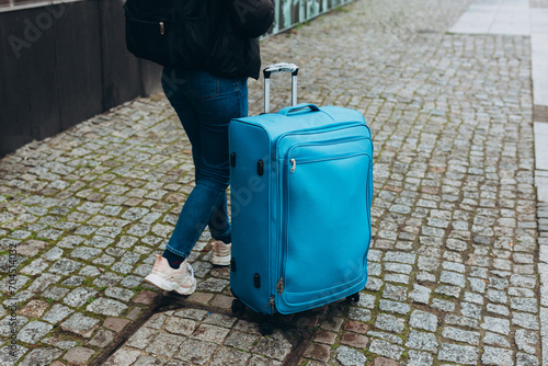 Fotografi Travel luggage of empty European street