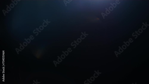 4K Lens flare and bokeh overlay on black background, abstract elegant light effects, transition overlay, high-quality organic footage lightleak, leak, flare for screen mode, optical rays. photo