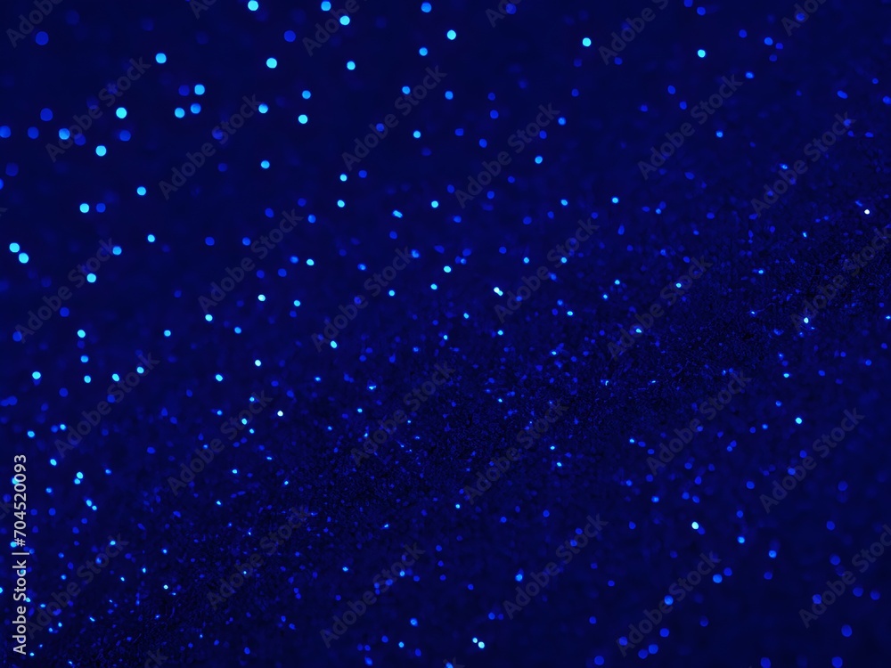 Gorgeous abstract backdrop featuring blue glitter and defocused lights Gorgeous abstract backdrop featuring blue glitter and defocused lights