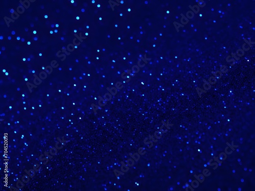 Gorgeous abstract backdrop featuring blue glitter and defocused lights © ahmta