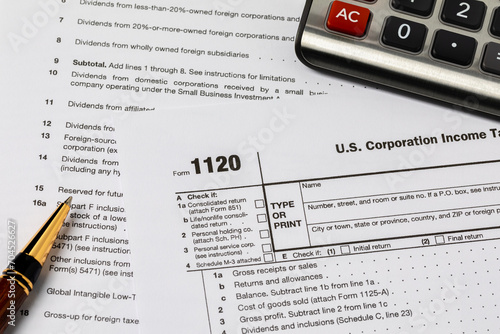 Corporation income tax form 1120. Tax reform, corporate tax code, and tax evasion concept.