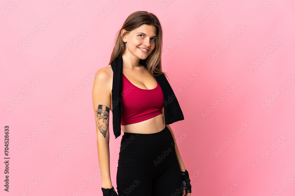 Young slovak woman isolated on pink background with sport towel Young slovak woman isolated on pink background with sport towel
