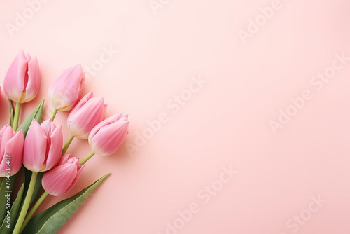 pink tulips in the right corner on a peach background
