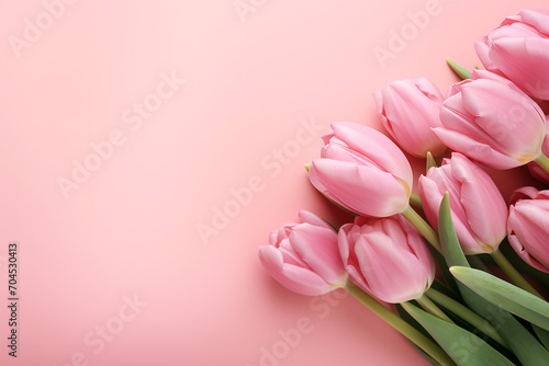 background with space for text, pink background and delicate tulips in the right corner