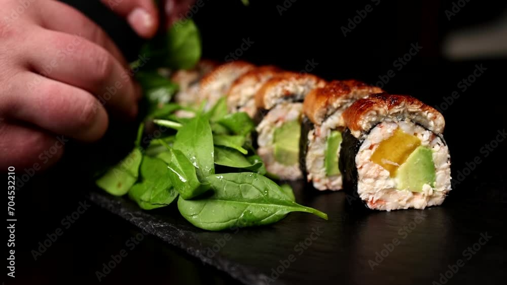 The chef prepares delicious rolls. Close-up The chef prepares delicious rolls. Close-up