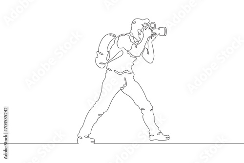 Fototapeta Naklejka Na Ścianę i Meble -  Photographer on the set. Photographer with a camera in his hands. The cameraman is filming. One continuous line drawing. Linear. Hand drawn, white background. One line