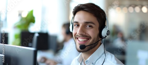 Charming, good-looking male call center worker. photo