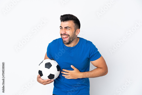 Handsome young football player man over isolated wall smiling a lot