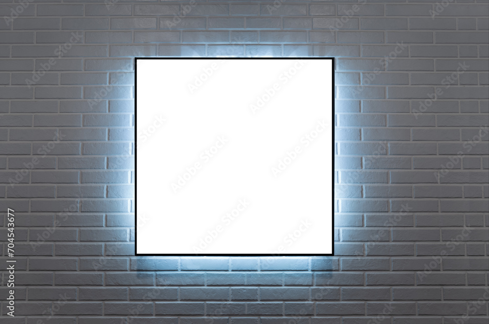 frame hanging on a brick wall illuminated wit LED light frame hanging on a brick wall illuminated wit LED light