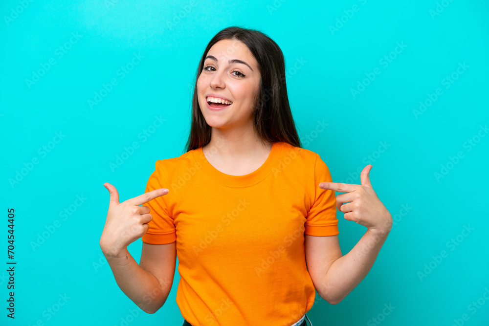 Fototapeta premium Young caucasian woman isolated on blue background proud and self-satisfied