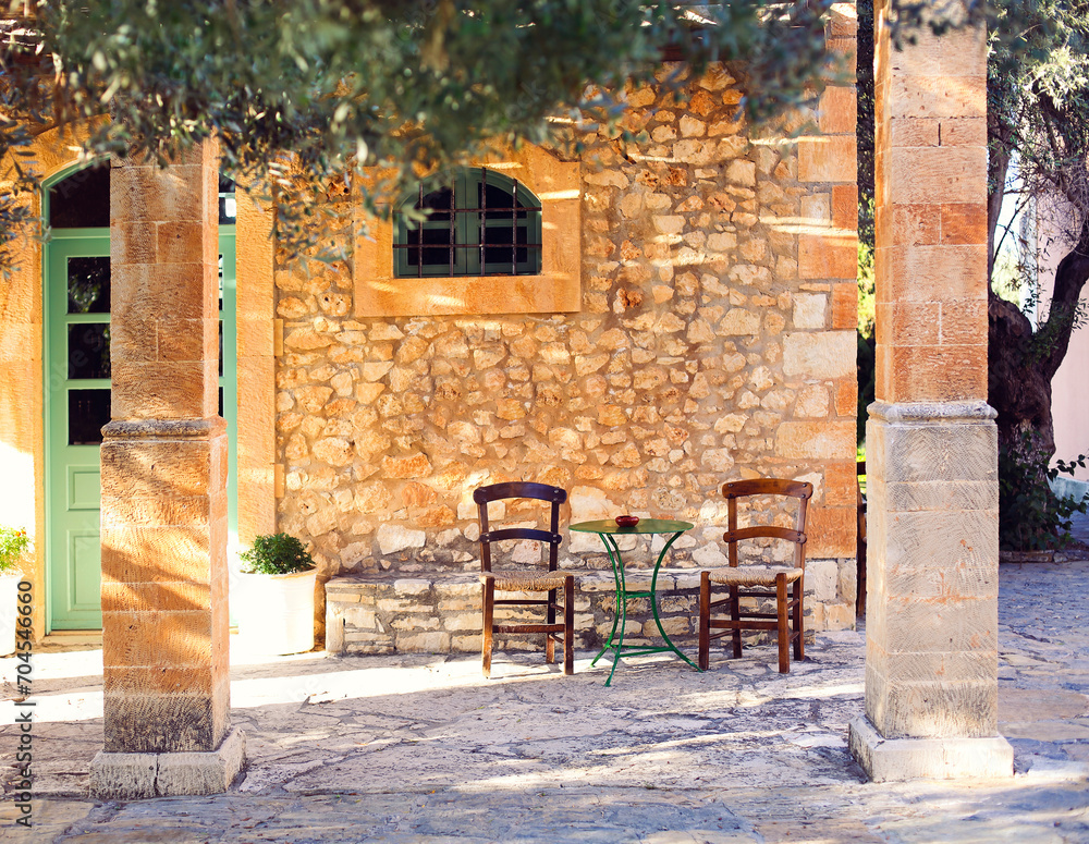 Old porch and yard with olive tree