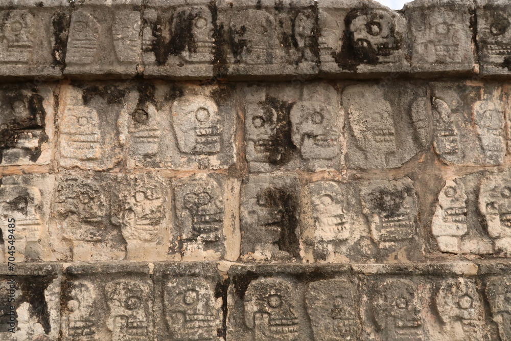 Skull pattern on the Tzompantli, skull platform, plataforma de los craneos, at Chichen Itza, close to Valladolid, Mexico