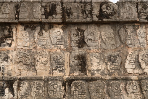 Skull pattern on the Tzompantli, skull platform, plataforma de los craneos, at Chichen Itza, close to Valladolid, Mexico