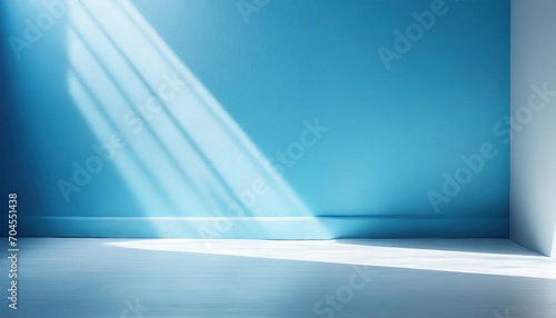 minimal abstract light blue background for product presentation incident light from window on wall and floor