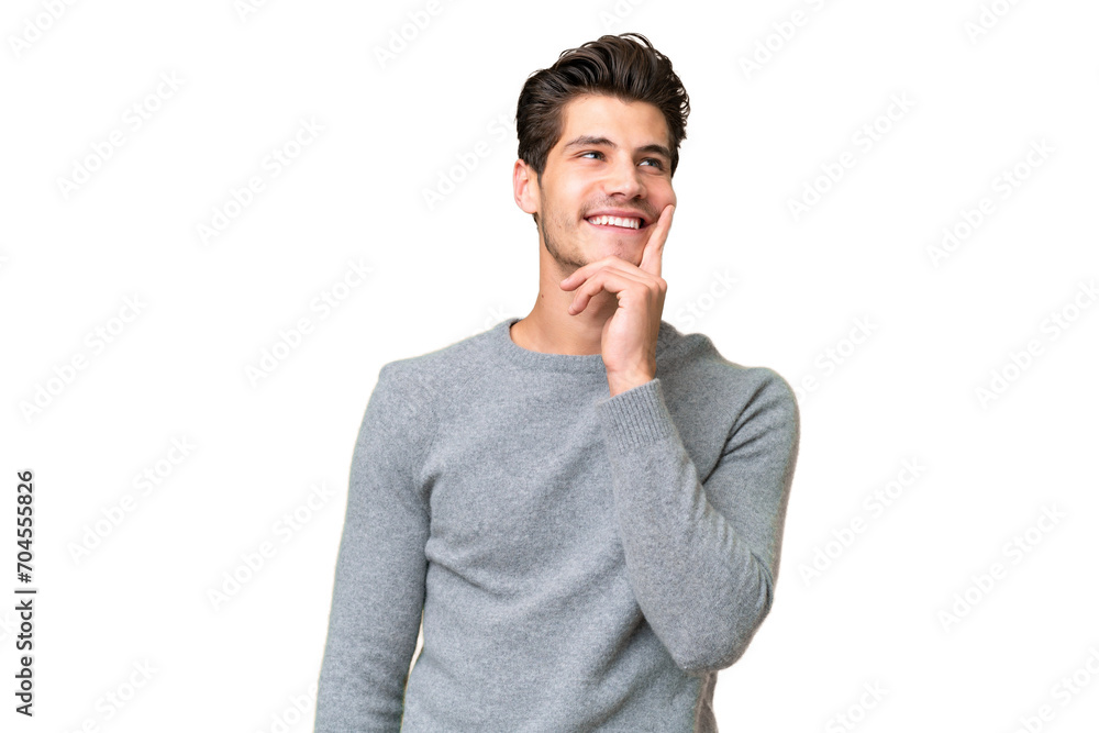 Young handsome caucasian man over isolated background thinking an idea while looking up Young handsome caucasian man over isolated background thinking an idea while looking up