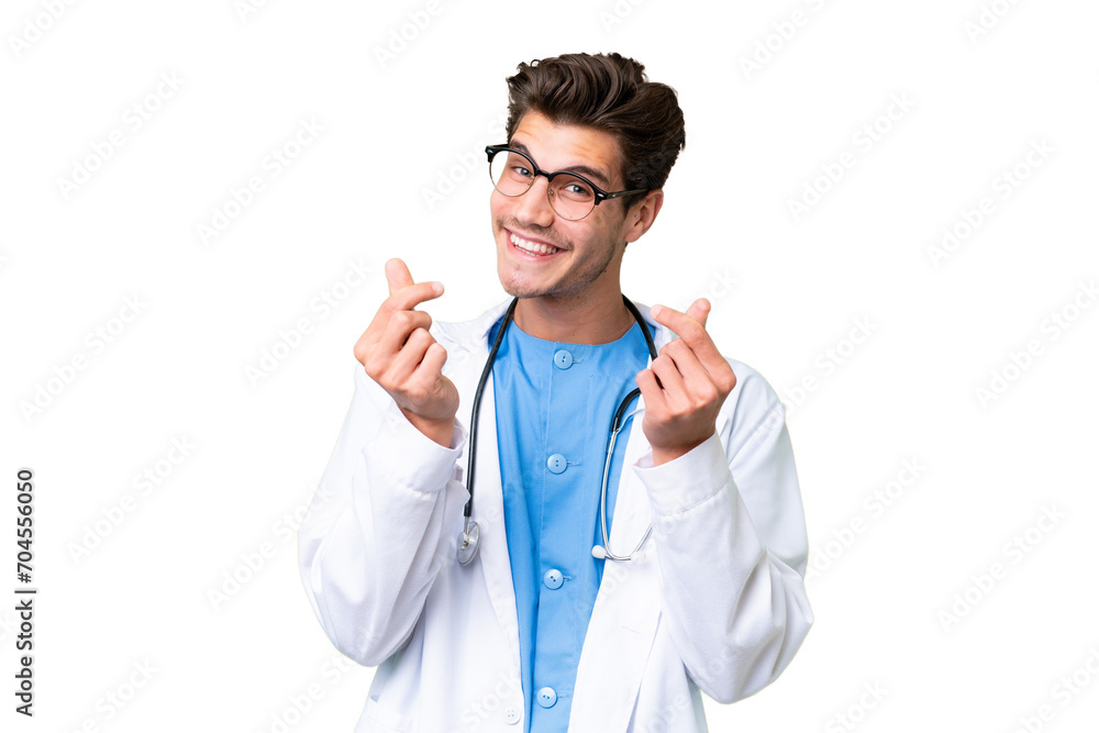 Young doctor man over isolated background making money gesture Young doctor man over isolated background making money gesture