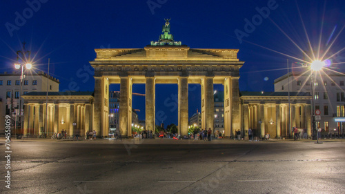Brandenburg Arch in Berlin illuminated in the night sky