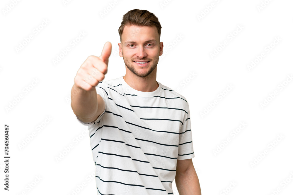 Young blonde caucasian man over isolated background with thumbs up because something good has happened Young blonde caucasian man over isolated background with thumbs up because something good has happened