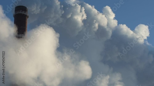 The strong vapor is clubbed into clouds in heavy frost. Heating station and its vapors when heating a city