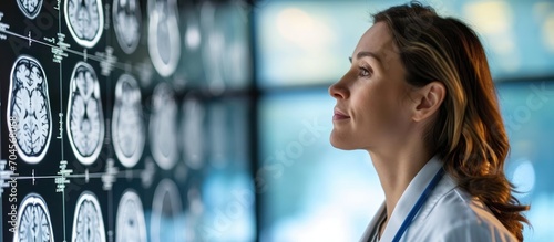 Radiologist confidently explains brain scan to patient. photo