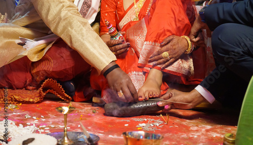 Closeup of indian hindu couple holding each other hands during marriage symbolizing love togetherness and promise bride groom wedding ring Bride & Groom Hand' Together in Indian Wedding photo