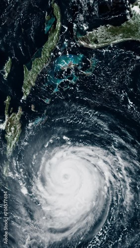 Hurricane eye rotating on the sea view from satellite, vertical video animation based on image by Nasa