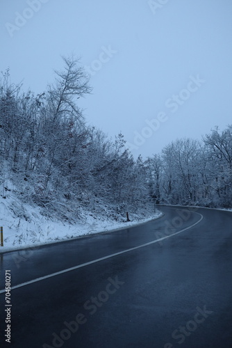 Snowy Road near the forest, winter background
