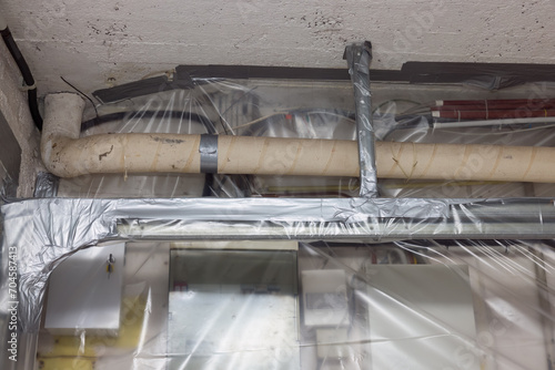 Asbestos removal off heating pipes photo