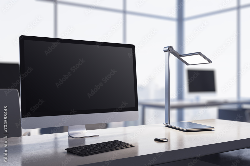 Fototapeta premium Modern bright designer desktop with computer monitor, coffee cup, supplies, other objects and window with city view in the background. Mock up, 3D Rendering.