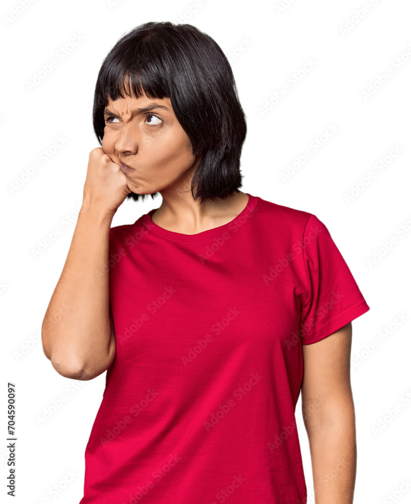 Young Hispanic woman with short black hair in studio who feels sad and pensive, looking at copy space. Young Hispanic woman with short black hair in studio who feels sad and pensive, looking at copy space.