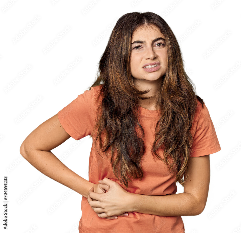 Young Caucasian woman in studio setting having a liver pain, stomach ache. Young Caucasian woman in studio setting having a liver pain, stomach ache.