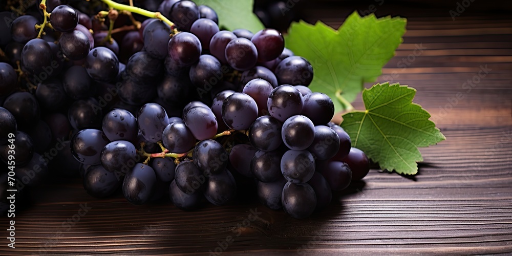 Black grapes on rustic wooden table, space to copy. Black grapes on rustic wooden table, space to copy.