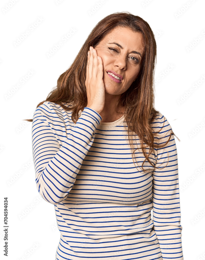 Middle-aged woman portrait in studio setting having a strong teeth pain, molar ache. Middle-aged woman portrait in studio setting having a strong teeth pain, molar ache.