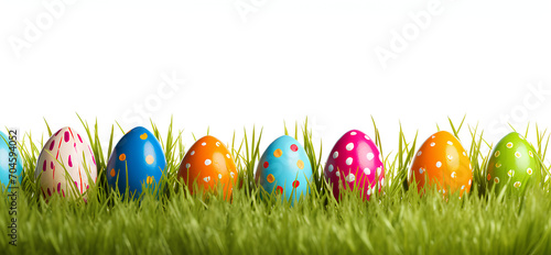 Collection of colorful painted Easter eggs on green grass and transparent background.