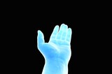 Blue hand stretched out with a cognitive gesture against a black background - topic Artificial intelligence AI