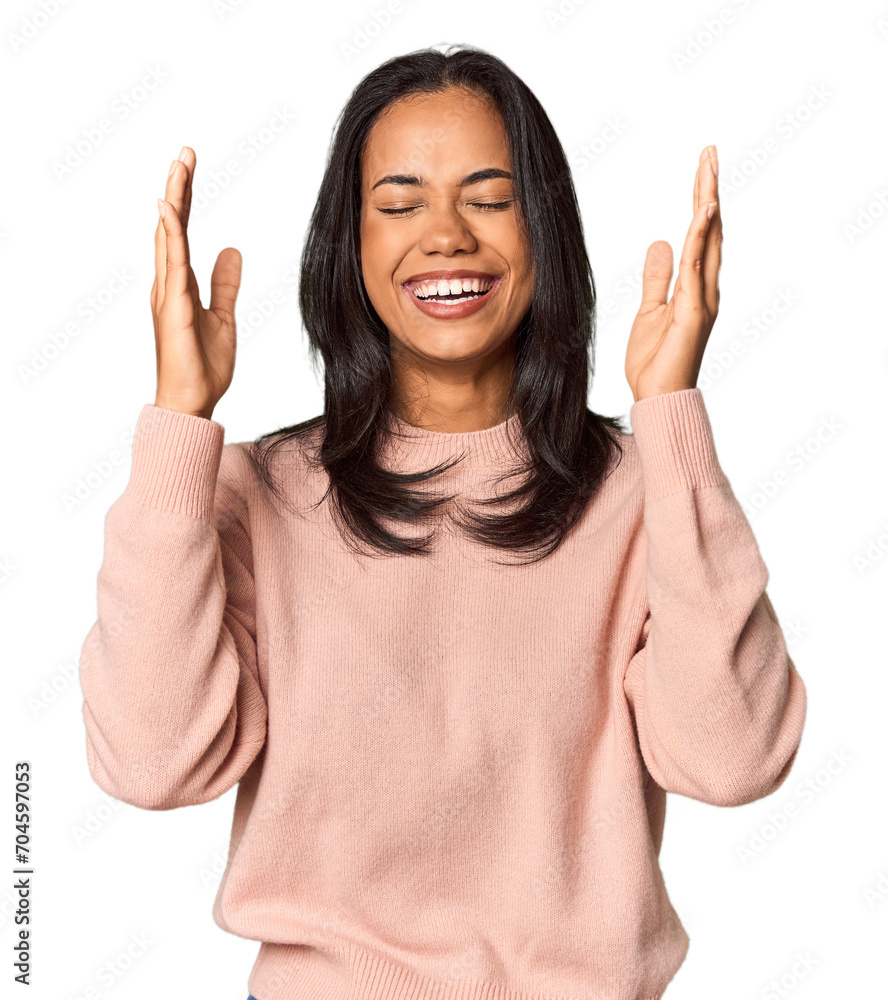 Young Filipina with long black hair in studio joyful laughing a lot. Happiness concept. Young Filipina with long black hair in studio joyful laughing a lot. Happiness concept.