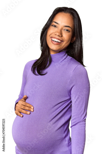 Fotografie Radiant young pregnant Filipina woman in studio