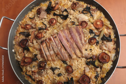 pork jowl and muschrooms spanish rice photo