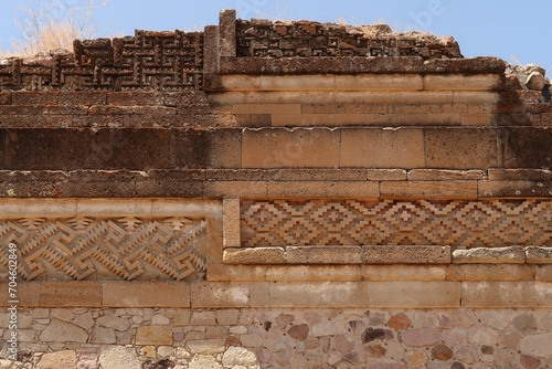 Facade of one of the temples of the Group of Columns, many different materials, layers, patterns and styles, Mitla, Mexico