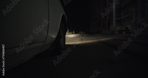 Poor Neighborhood Of Row Homes. Old Car during night. Crime abandoned area. 