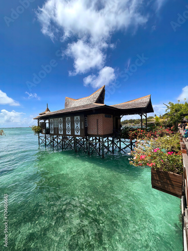Escape to Mabul Island Malaysia for a luxury tropical paradise. Crystal waters, overwater bungalows, and vibrant marine life await your perfect getaway.