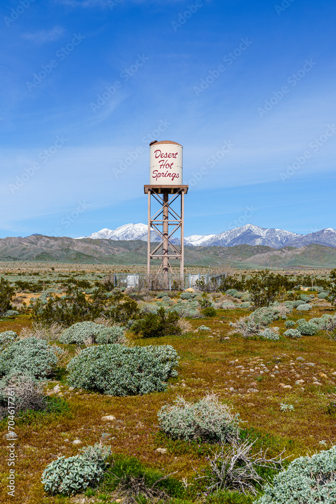 Desert Hot Springs, California water tower centered in frame with snow capped San Gorgonio Mountains in the background. Shot vertically. Desert Hot Springs, California water tower centered in frame with snow capped San Gorgonio Mountains in the background. Shot vertically.