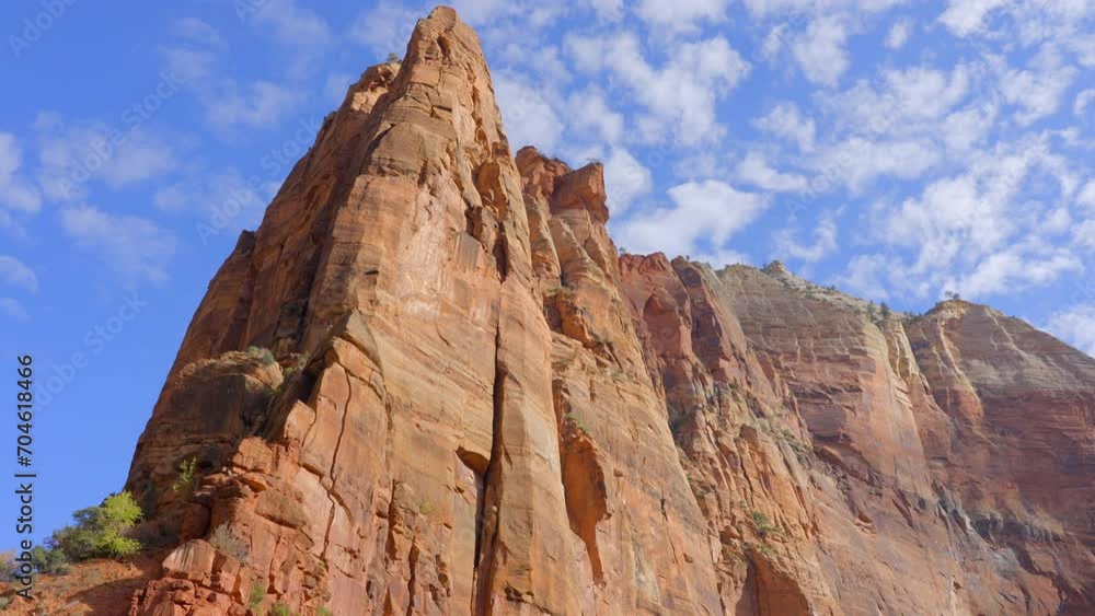Establishing shot of mountains with red rocks in Emerald Pools Trail, Zion National Park, Utah, North America. Day time. ProRes 422 HQ. Establishing shot of mountains with red rocks in Emerald Pools Trail, Zion National Park, Utah, North America. Day time. ProRes 422 HQ.