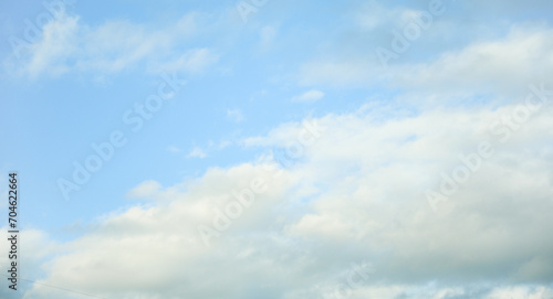 sky filled with fluffy clouds, symbolizing serenity and freedom