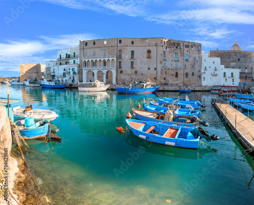 Fotografie Old port of Monopoli in Apulia, southern Italy: view of the old town with fishing and rowing boats