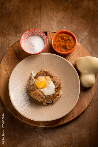 minced meat nest with scamorza cheese and egg photo